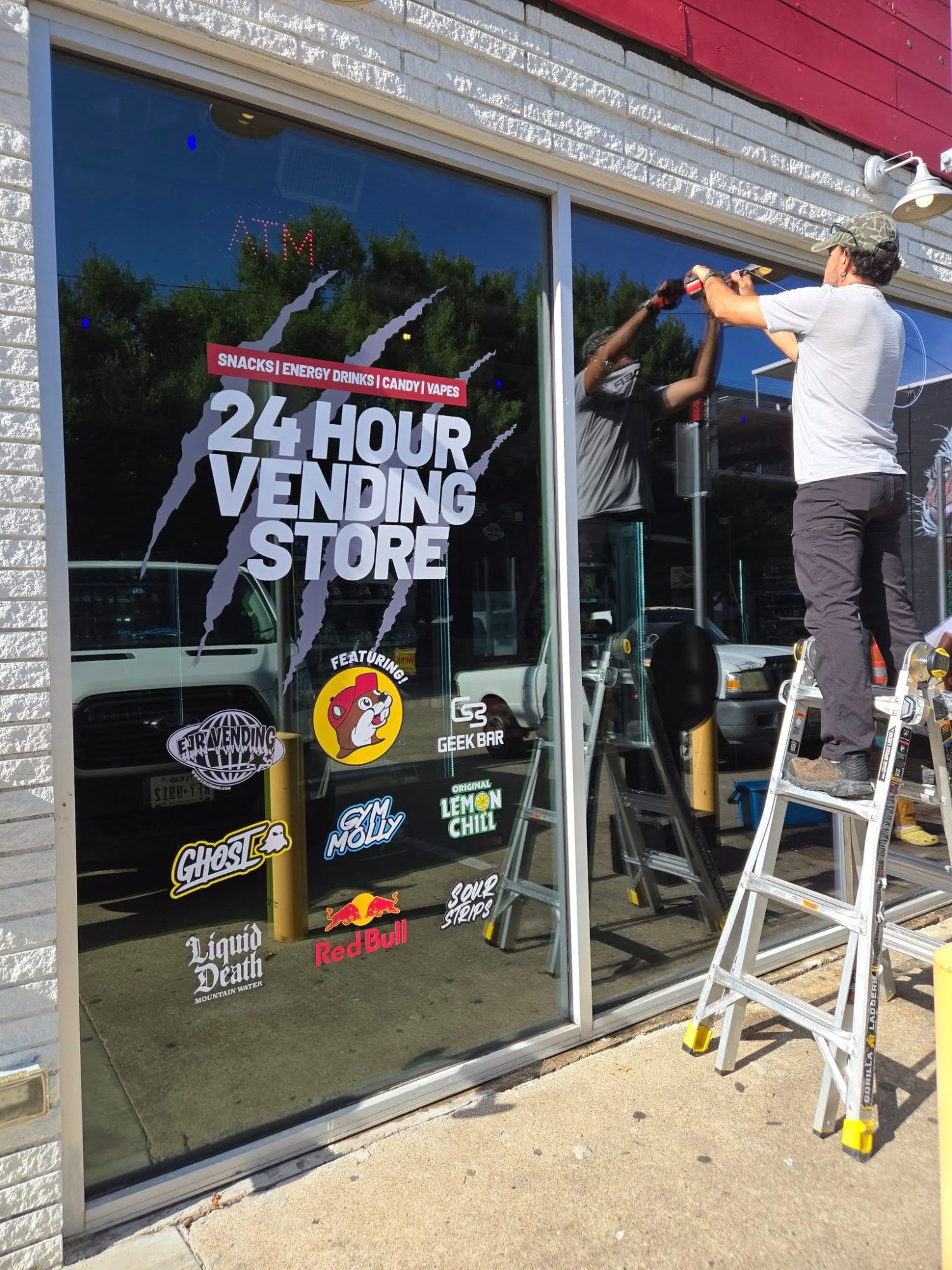 Outdoor window decal signage installation for a retail business in Fort Worth